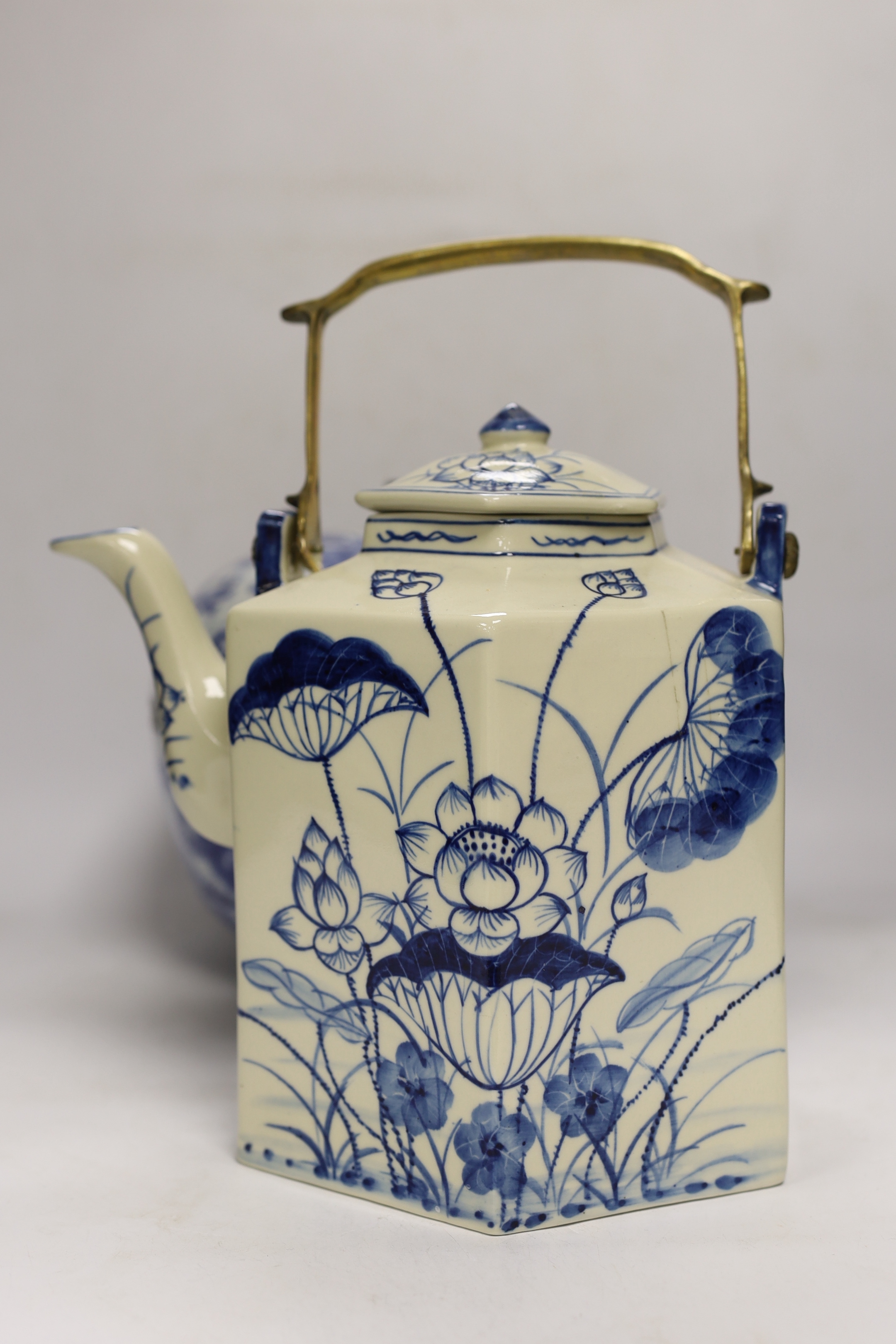 Four modern Chinese blue and white ceramic items; two teapots, a lidded vessel and a bowl, tallest 23.5cm